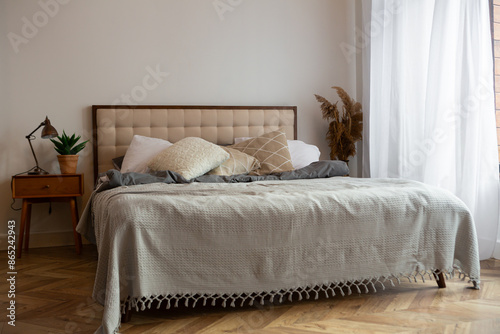 Cozy room with beds and textile