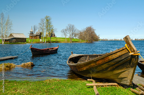  Wooden buildings. Boats, a watermill,