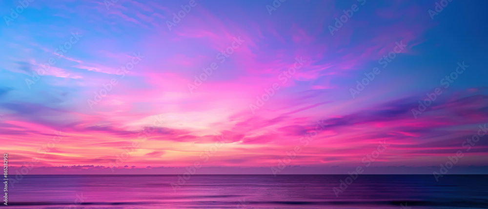 A beautiful sunset over the ocean with a pink and purple sky A beautiful sunset over the ocean with a pink and purple sky