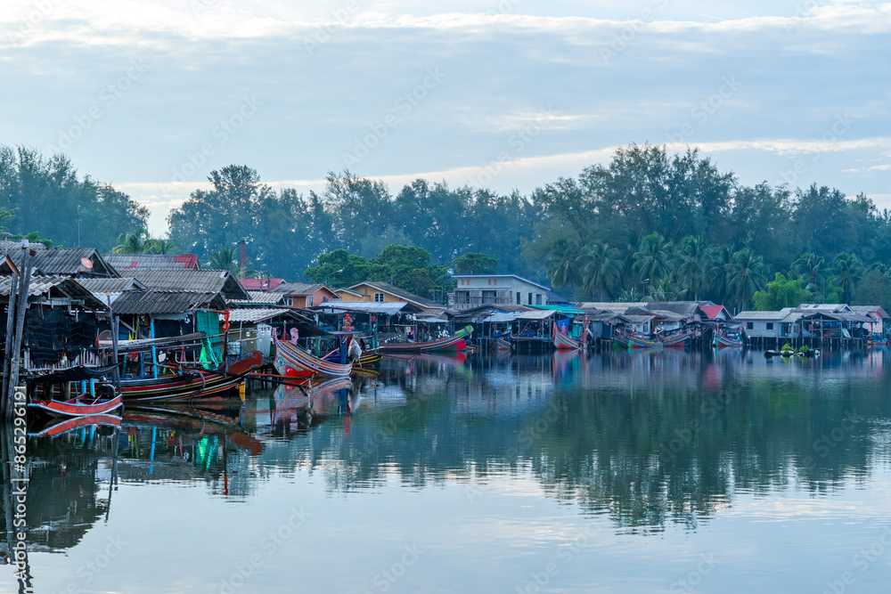 Obraz premium Sunset of Bang Nara River Village and Kolae boat of local fisherman at Narathiwat Province Southern of Thailand.