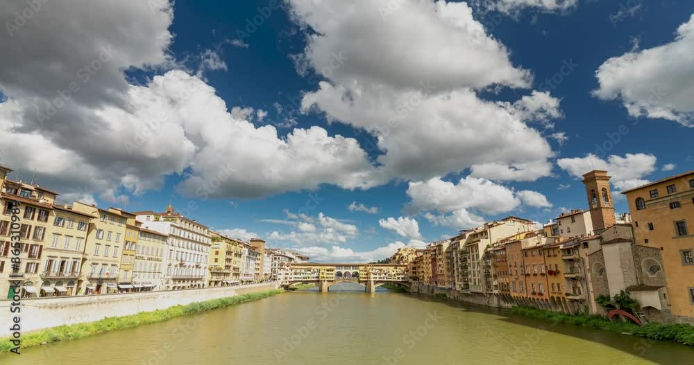 Florence, Italy - May 31, 2024: Ponte Vecchio bridge on Arno river. Time-lapse, slide transition. Working tap on the background. Medium cloudy sky.