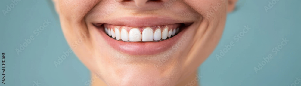 Fototapeta premium A closeup of a persons face showing a genuine smile, the eyes crinkling with joy, natural lighting