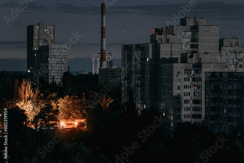 Panel residential buildings during blackout of electricity at night. View on a panel residential buildings during blackout of electricity at night. Night city skyline. Outage of the power.