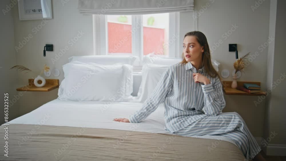 Thoughtful lady relaxing bed in quiet home atmosphere. Beautiful relaxed woman