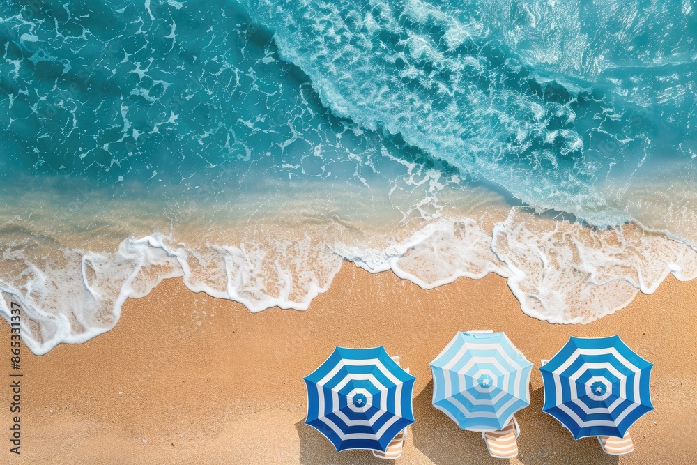 Naklejka premium Aerial view of Beach for summer vacation, swimming, and sunbathing on a sunny day. Top view of Summertime umbrellas