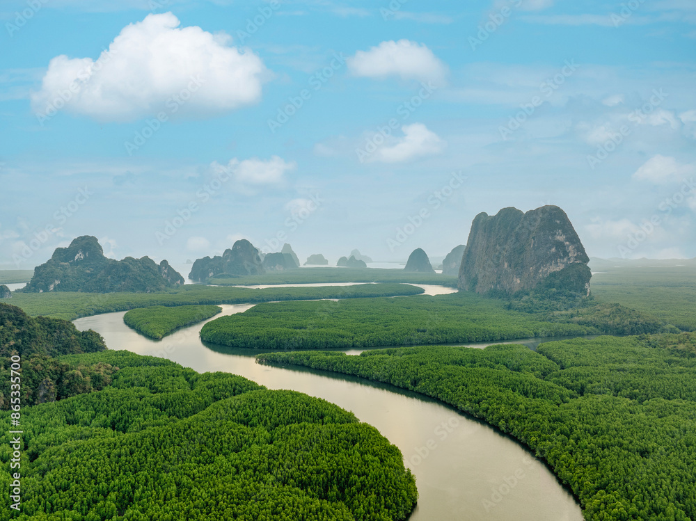 View from above, aerial shot, stunning view of Ao Phang Nga (Phang Nga Bay) National Park featuring a multitude of limestone formations rising from the sea. Thailand.