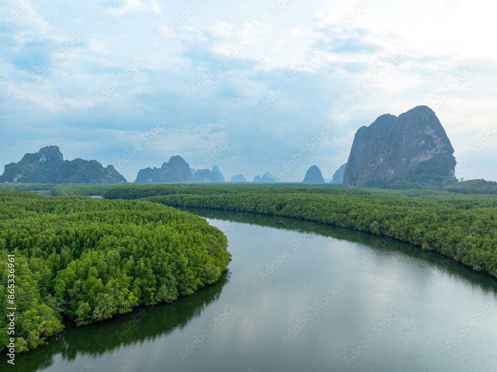 View from above, aerial shot, stunning view of Ao Phang Nga (Phang Nga Bay) National Park featuring a multitude of limestone formations rising from the sea. Thailand.