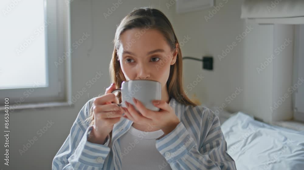 Relaxed girl enjoying tea in morning portraying serene enjoyment closeup. Relaxed girl enjoying tea in morning portraying serene enjoyment closeup.
