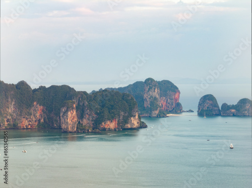 Obraz na płótnie View from above, stunning aerial view of the Ao Nang coast at sunset with the Ao Nang Tower, Tonsai beach and Railay Beach in the distance, Krabi, Thailand w salonie