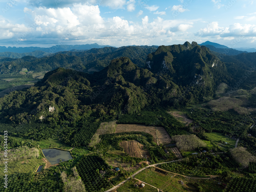 View from above, stunning aerial view of some limestone mountains during a cloudy day. Khao Sok National Park, Thailand.
