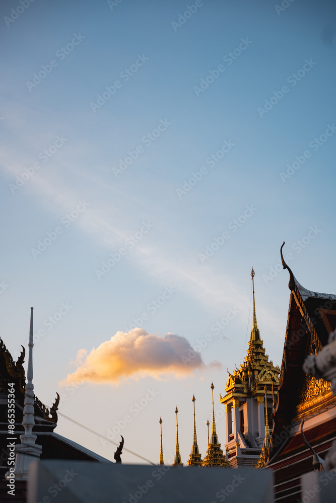 Stunning view of the Wat Ratchanatdaram at sunset, a beautiful Buddhist temple that stands proud in the heart of downtown Bangkok, Thailand.