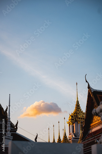 Obraz na płótnie Stunning view of the Wat Ratchanatdaram at sunset, a beautiful Buddhist temple that stands proud in the heart of downtown Bangkok, Thailand. w salonie