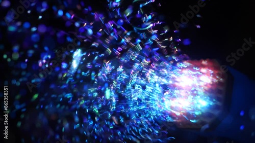 Colorful LED lit soap bubble machine in the dark