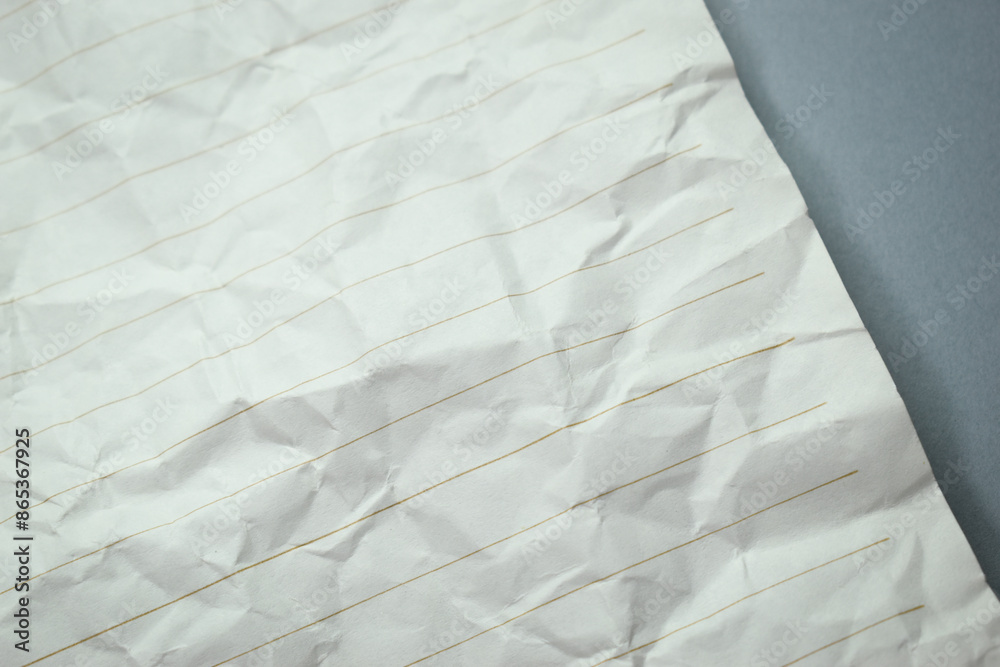 Obraz premium crumpled line paper texture on grey background, blank sheet notebook
