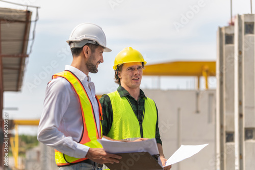 Engineer and foreman worker team inspect the construction site, Site manager and builder on construction site. © Poguz.P