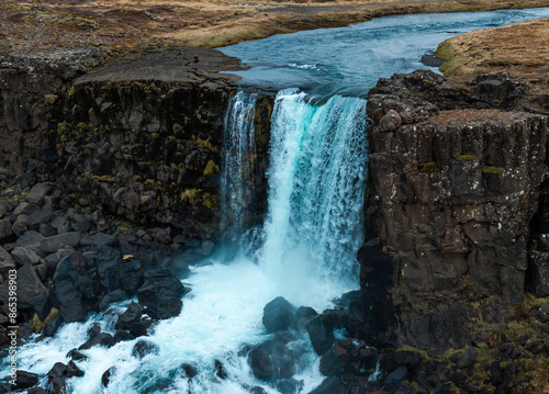 Aerial panorama of Oxarafoss waterfalls in Thingvellir National Park, Iceland, featuring the scenic Oxara River and the unique landscape created by the tectonic plates of America and Eurasia. photo