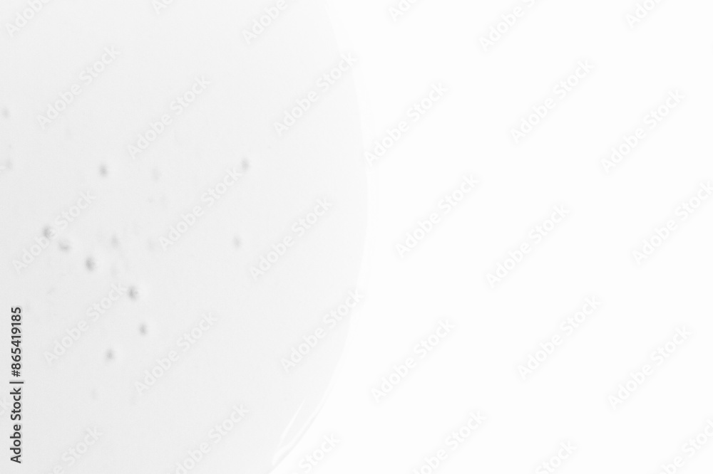 A drop of transparent gel on a light background. Empty space A drop of transparent gel on a light background. Empty space