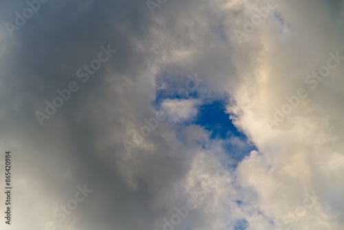 Fototapeta Naklejka Na Ścianę i Meble -  Summer sky with dark clouds illuminated by the sun.                               