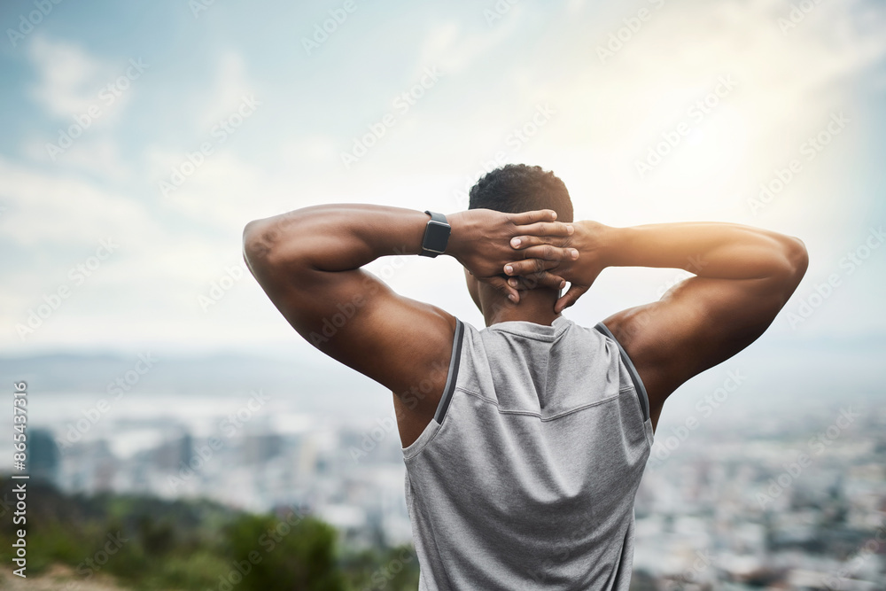 Fototapeta premium Back, fitness and black man stretching arms in city with thinking, outdoor exercise and calm morning view. Health, wellness and athlete at sunrise with warm up for muscle, urban workout and relax