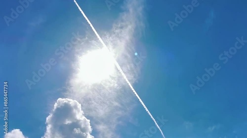 Blue sky with chemical chemtrails cumulus clouds scalar waves sky.
