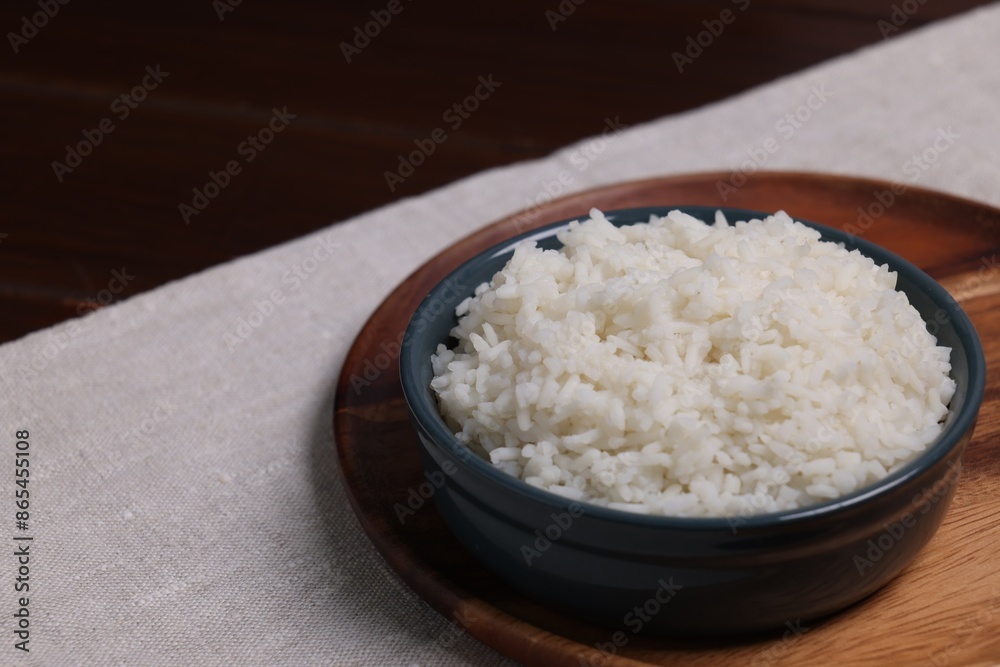 Delicious boiled rice served on table. Space for text Delicious boiled rice served on table. Space for text