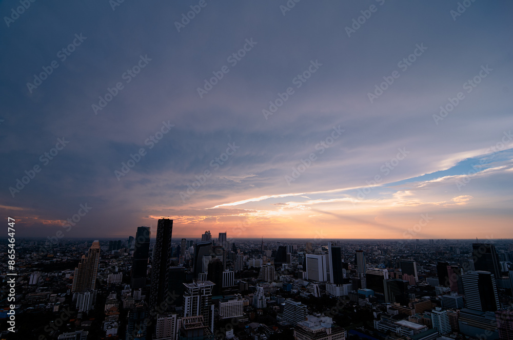 Obraz premium Sunset in megalopolis. Beautiful cityscape with top view on skyscrapers. Bangkok, Thailand.
