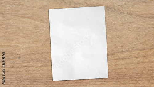 empty blank white grunge paper sheet placed on light oak wooden table counter, top view. sheet of blank note paper with blank space for design.