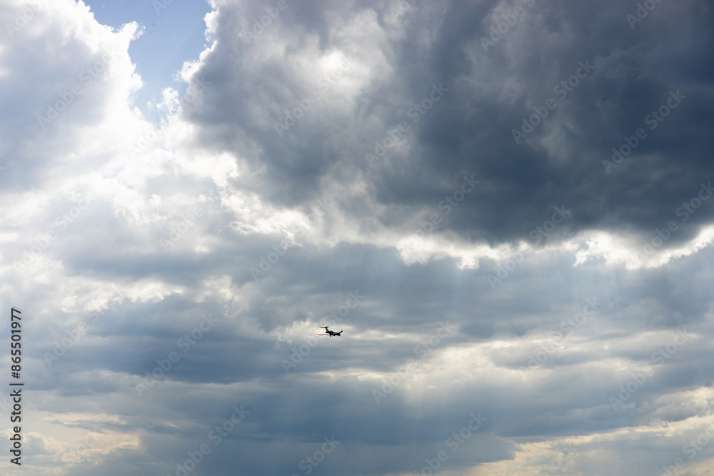 Passenger airplane flying in the sky amazing clouds in the background. Travel by air transport. Passenger airplane flying in the sky amazing clouds in the background. Travel by air transport.