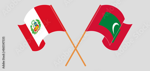 Crossed and waving flags of Peru and Maldives