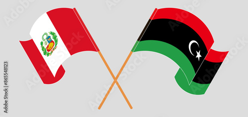 Crossed and waving flags of Peru and Libya