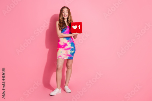 Full length photo of charming positive girl wear retro outfit holding feedback sign empty space isolated pink color background