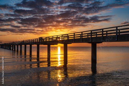 Fototapeta Naklejka Na Ścianę i Meble -  Fantastically beautiful sunrise on the pier in Boltenhagen on the Baltic Sea