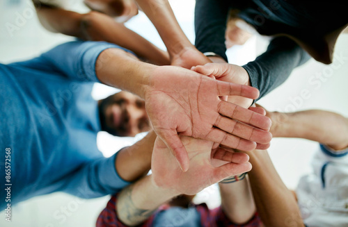 Business people, hands and huddle for team building in office, support and collaboration. Staff, creative agency and low angle for community in company, solidarity and stack together for sale mission