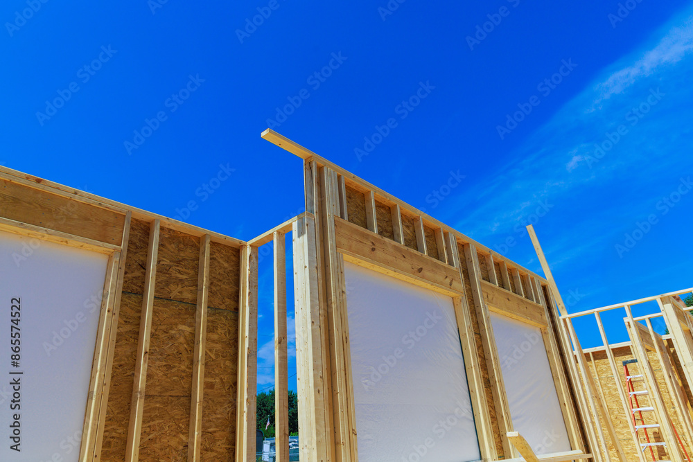 Building frame for unfinished interior timber support beams during construction of new building Building frame for unfinished interior timber support beams during construction of new building