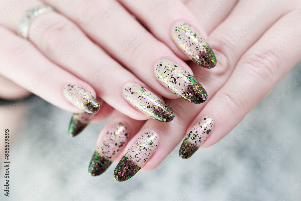 Woman's hands with long nails and white and black thermo french manicure Woman's hands with long nails and white and black thermo french manicure