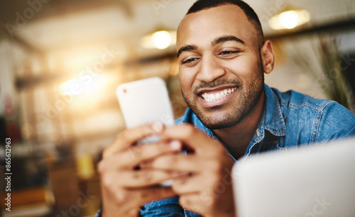 African man, cellphone and online in cafe with happiness, chatting and match from dating website. Restaurant, male person and smartphone for mobile app, social media and message with contact or smile