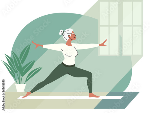An elderly woman is doing yoga. Gray-haired woman stands in Virabhadrasana II pose. Woman does physical exercise. Healthy lifestyle. Sports at home