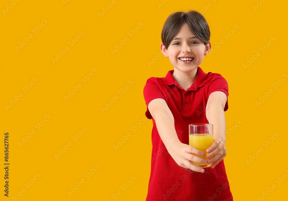 Little boy with glass of orange juice on color background Little boy with glass of orange juice on color background