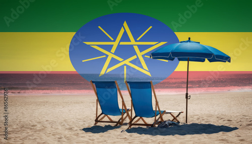 Two blue beach chairs and an umbrella await, inviting travelers to experience a relaxing Ethiopia beach vacation photo