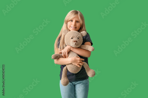 Cute little girl with plush...