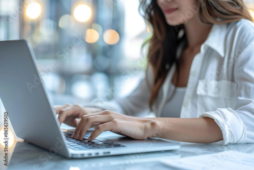 Close up of a woman's hands typing on a laptop keyboard, working, typing, computer, office, technology, desk, female, professional, job, business, workplace, internet, communication, online