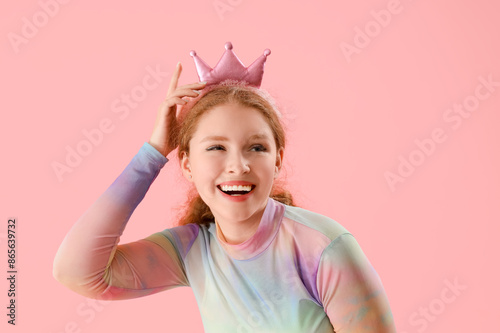 Smiling young redhead woman...