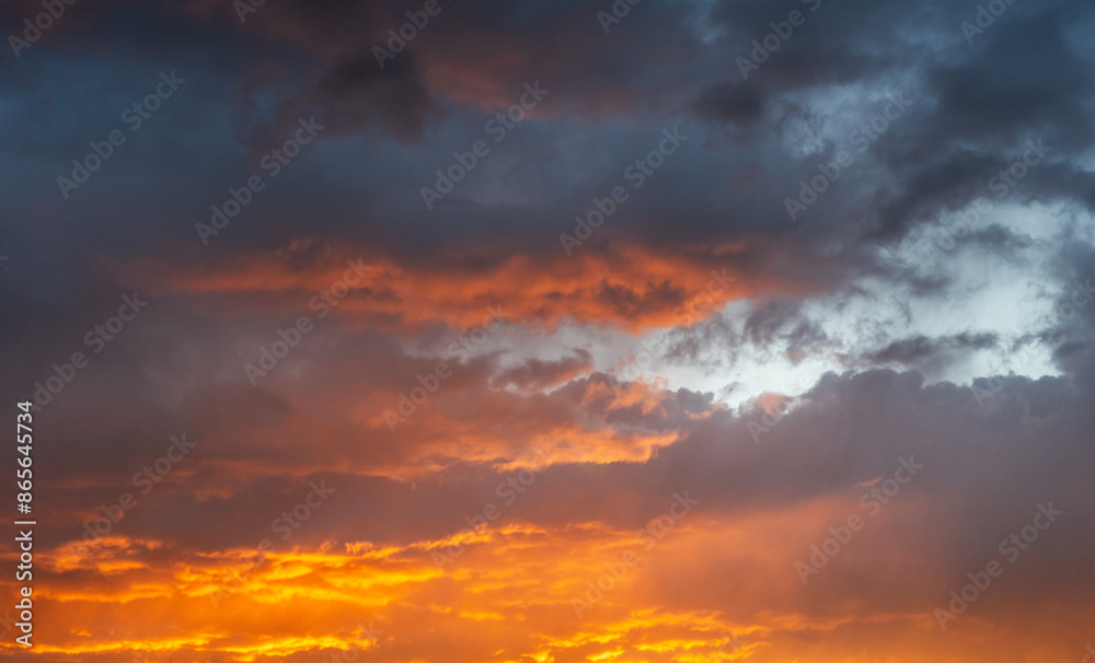 Obraz premium Sky background. Bright orange sunset sky with clouds.