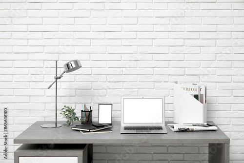 Stylish workplace with mode...