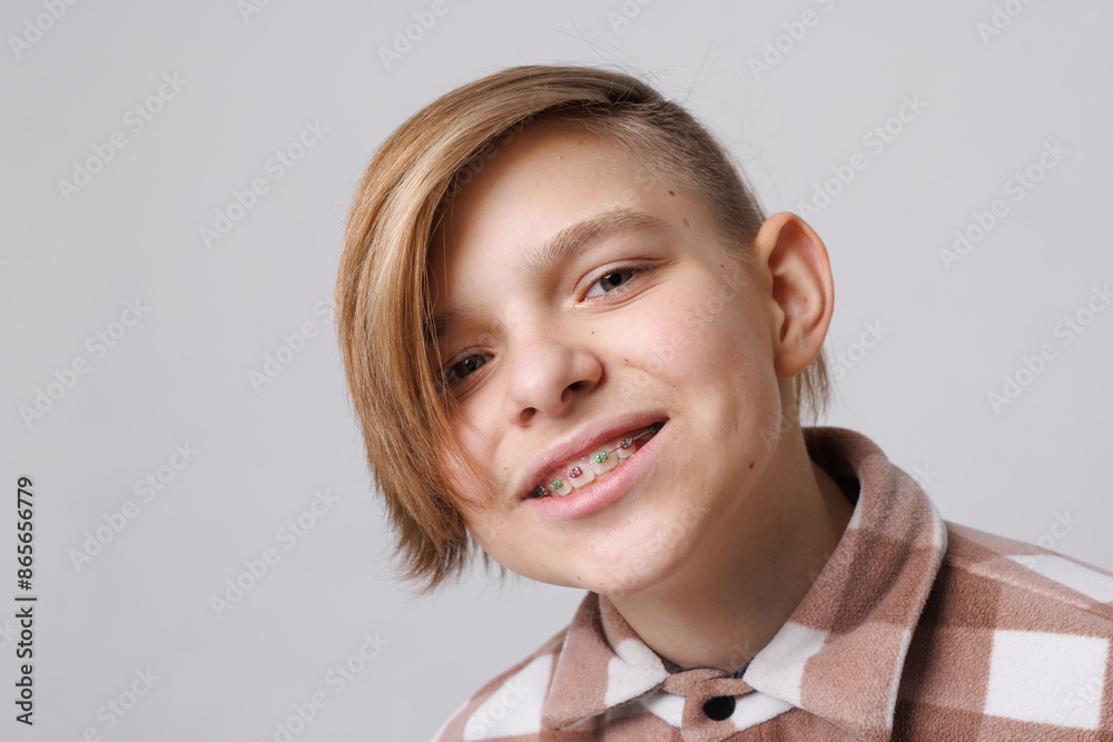 close-up portrait of a teenager with braces, the boy is happy with braces close-up portrait of a teenager with braces, the boy is happy with braces