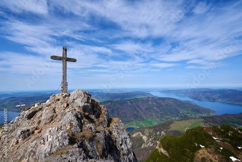 A cross from the top of the mountain Schafberg. Beautiful landscape. Salzkammergut region, St. Gilgen, Austria.