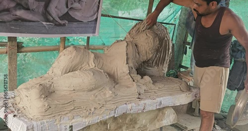 From Clay to Plaster of Paris mold- Indian Sculptor Artist Are crafting Plaster Of Paris Mold of a Dying warrior (fallen Trojan warrior, probably Laomedon) clay Sculpture..
 photo