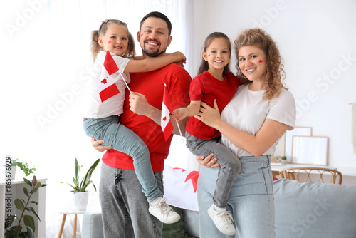 Happy family with flags of ...