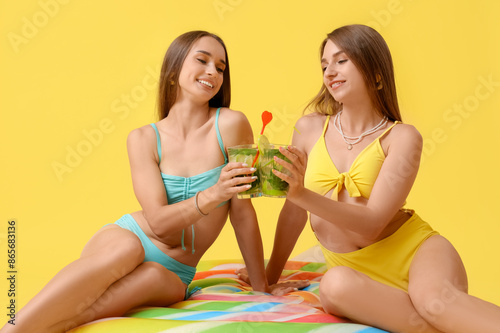 Young happy women in swimsu...
