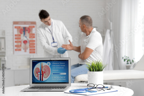 Open laptop on table at uro...